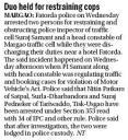 Duo held for restraining cops.JPG - 